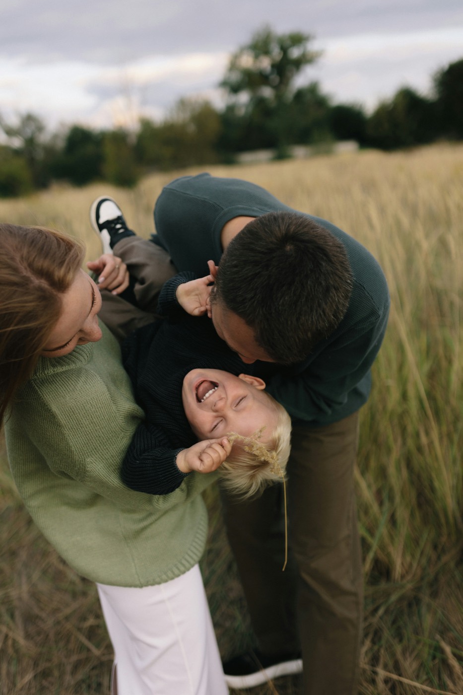 A family playing together in a field